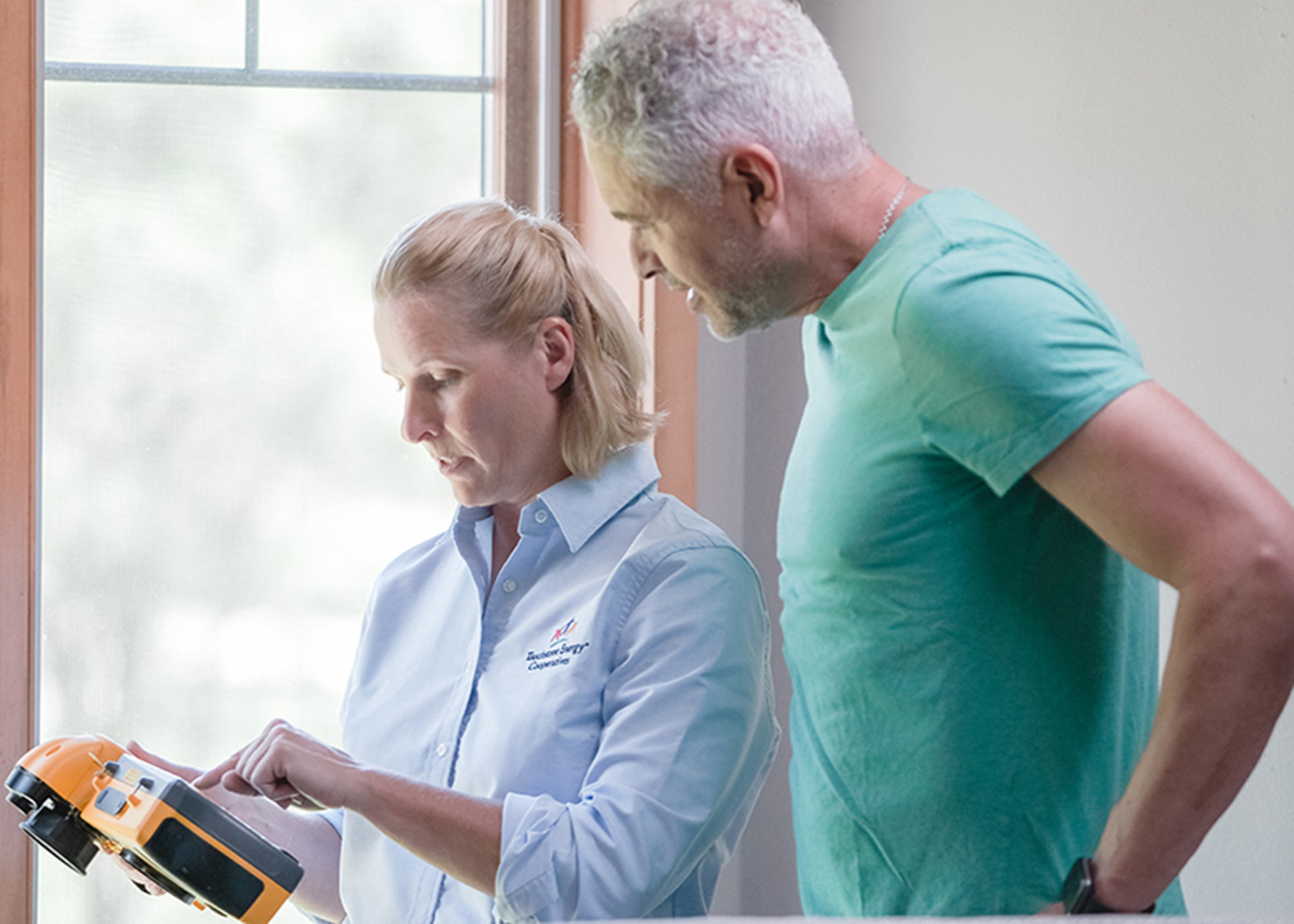 woman and man looking at report