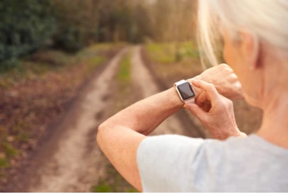 woman looking at smart watch