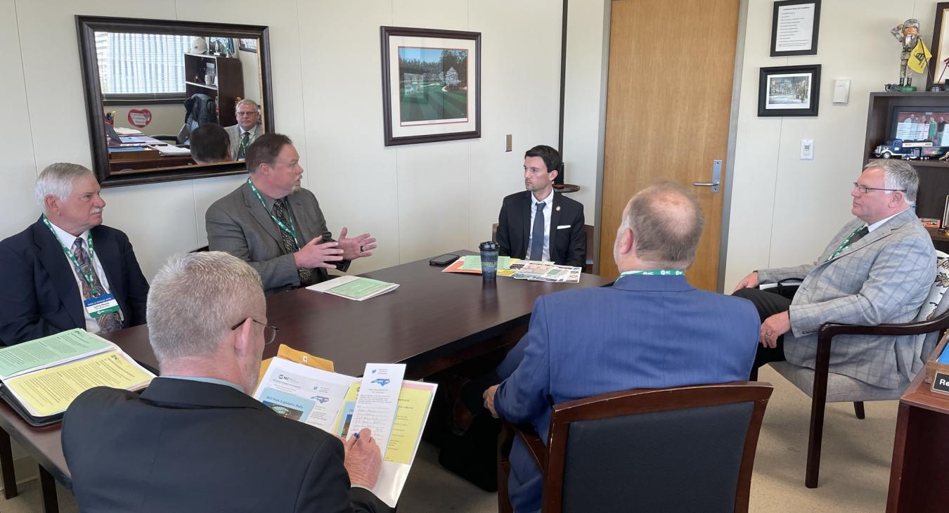 VP Jay Albright explains to Rep. Jon Hardister how REMC restored power during the Moore County outage in Dec. 2022.