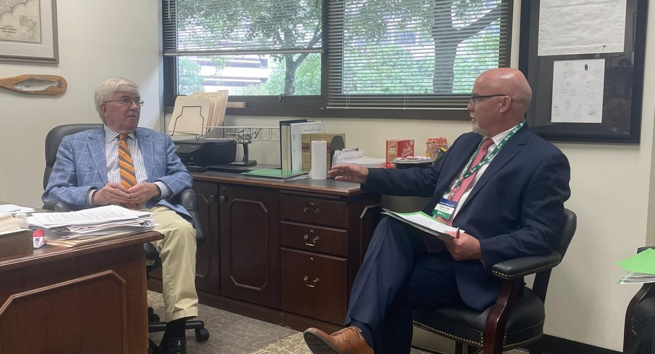 NC Senator Tom McInnis and REMC’s COO Dennis Mabe discuss solar power concerns.