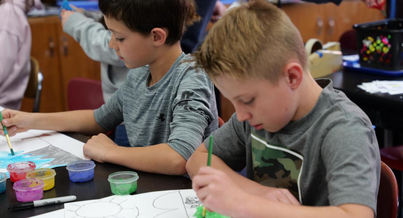 Third graders in Mr. Manning's class learn how to paint landscapes.