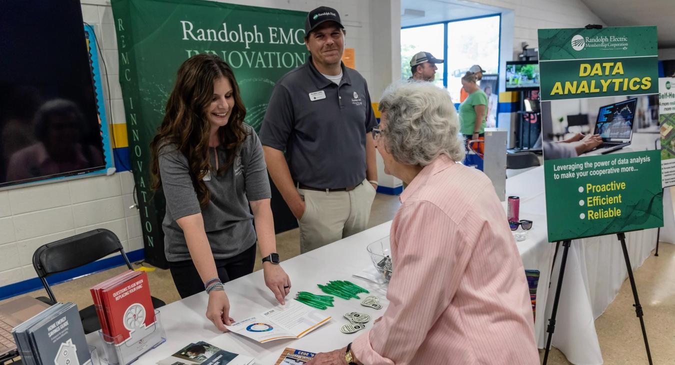 Brooke McNeill and Doug Loflin with a member. 
